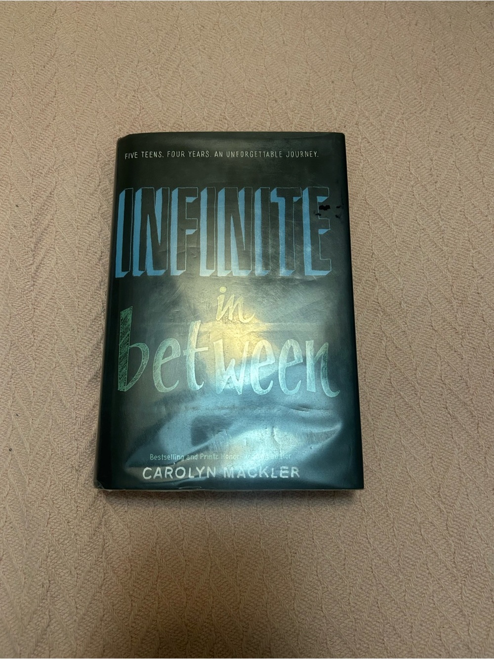 Infinite in Between by Carolyn Mackler - Hardcover